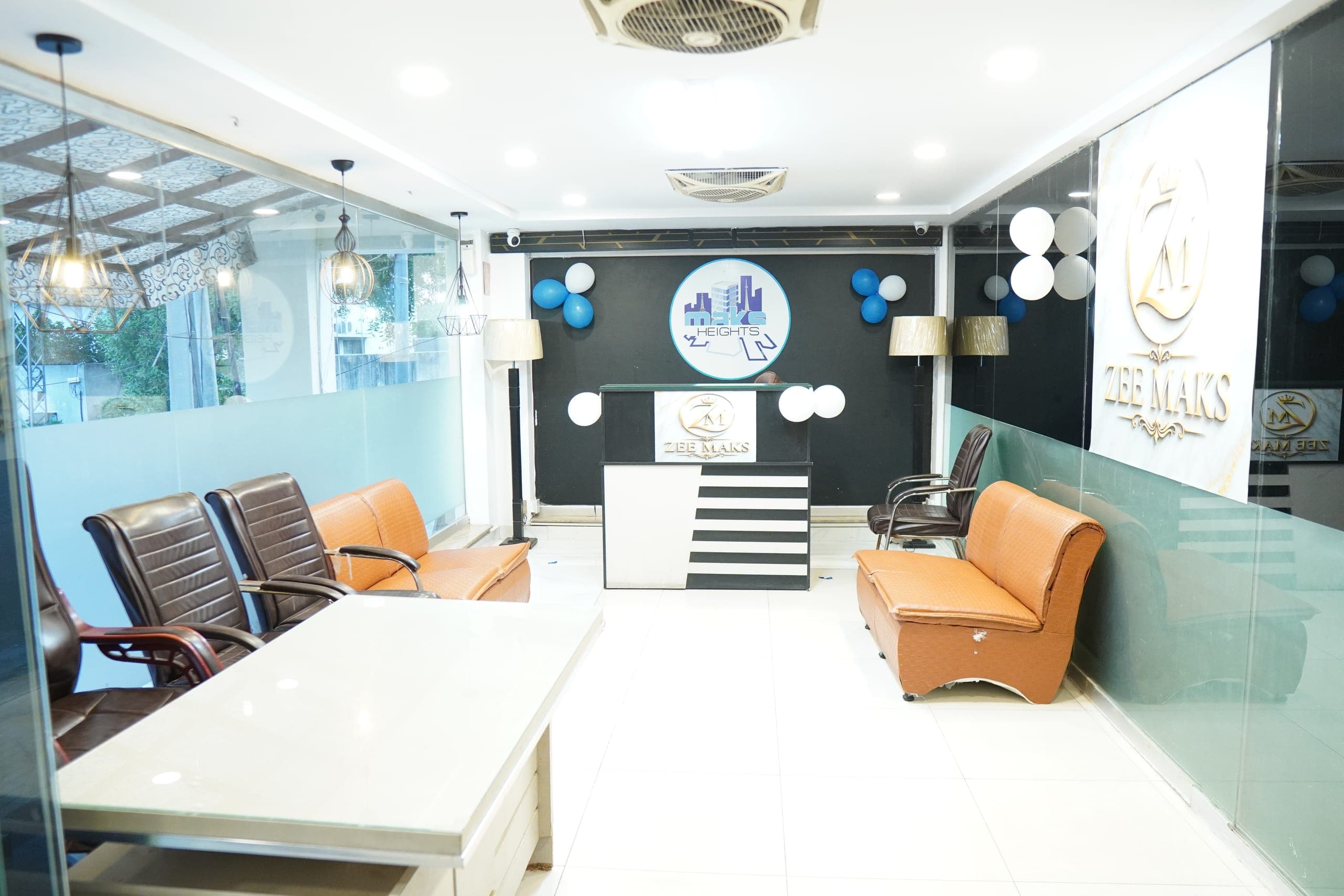 The ZEE MAKS reception, with the front desk and a seating area